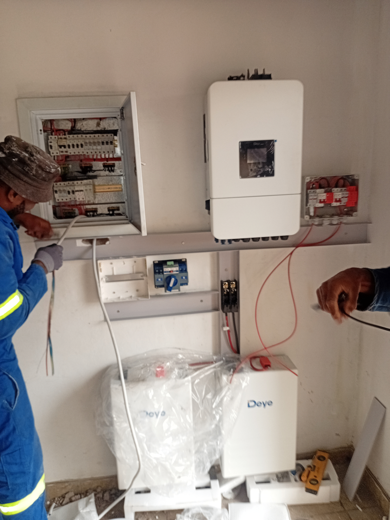 FPK electricians installing electrical distribution board and solar inverter